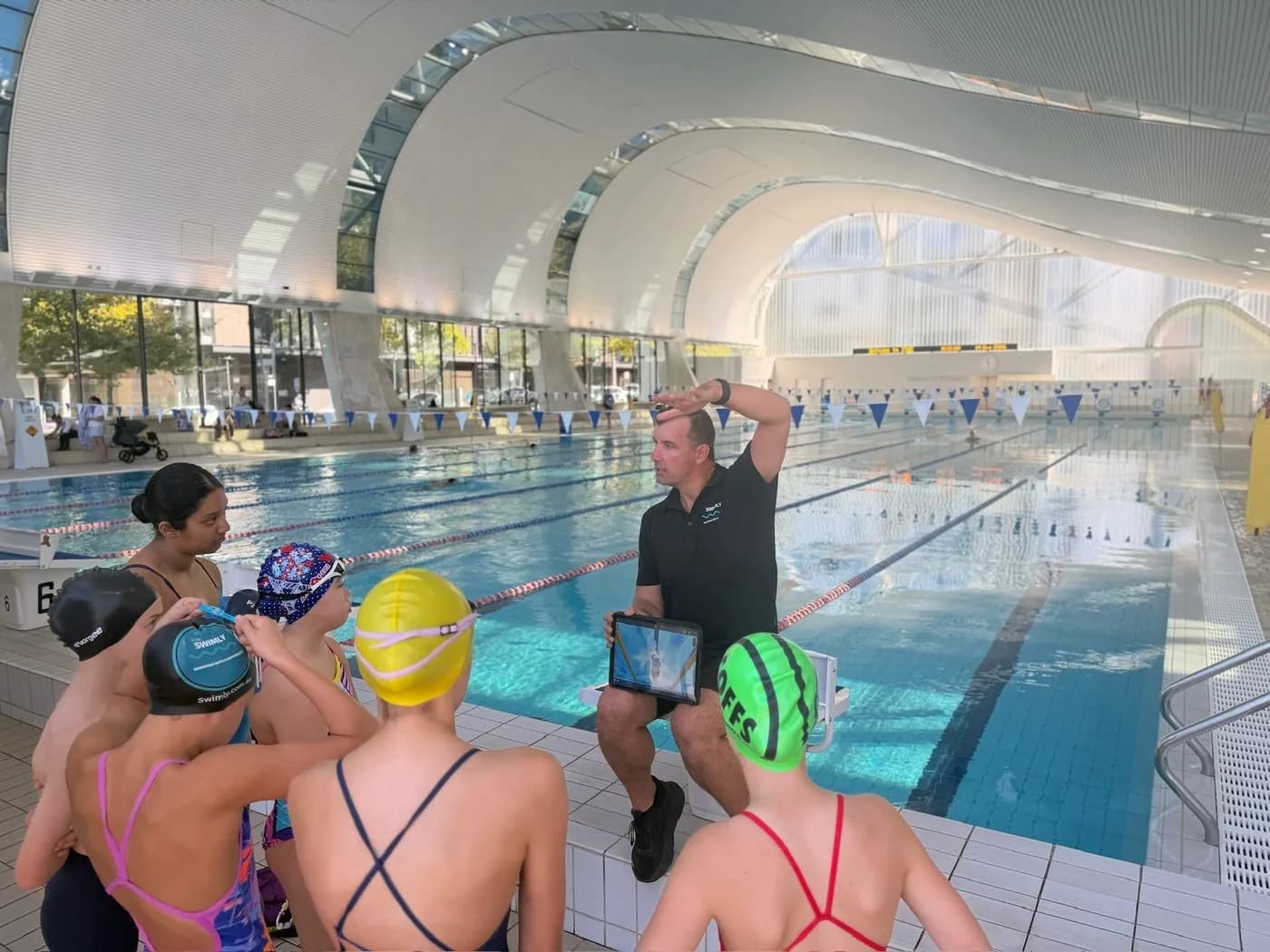 Swim parents and a squad at a meet